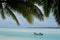 Fisherman in fishing boat on Aitutaki Lagoon Cook Islands