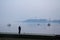 Fisherman fishing on the Danube river during a heavily foggy winter afternoon in Zemun, a northern district of Belgrade