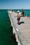 Fisherman fishing from jetty in Melbourne.