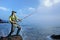 A fisherman fishing at the sea