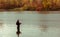 Fisherman fishing standing in water