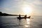 Fisherman go fishing silhouette in sunset / sunrise