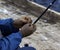 Fisherman grafts into the hook a Korean worm