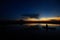 Fisherman on his traditional boat at sunrise