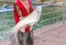 Fisherman holding a huge grass carp on a pier on a lake