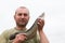 Fisherman holding a snakehead