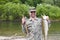 Fisherman holds caught pink salmon