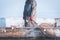 Fisherman holds a frozen fishing net in his hands