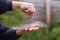 A fisherman holds a grayling fish in his hand