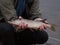 Fisherman holds small northern pike Esox lucius