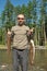 Fisherman holds up two large fish.