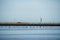 Fisherman hut, bamboo and wooden stick structure oyster farm above sea wetland with clear sky background