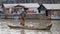 Fisherman with net in boat, Tonle Sap, Cambodia