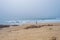 Fisherman person sihouette with fishing rod on empty beach