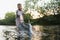 Fisherman picking up big rainbow trout from his fishing net