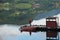 Fisherman on a pier on a fjord