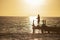 Fisherman on the pier at sunset in Bayahibe 4