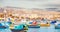Fisherman port village in Marsaxlokk Malta. Mediterranean traditional retro colorful boats luzzu on summer