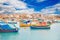 Fisherman port village in Marsaxlokk Malta. Mediterranean traditional retro colorful boats luzzu on summer