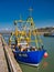 A fisherman prepare to land a catch from fishing boat Sam Lewette II MT 123 moored at Maryport on the Solway Coast in Cumbria