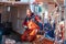 A fisherman pulling fish from his nets on his boat in the harbor of Trapani