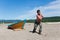 Fisherman pulls a heavy wooden boat