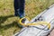 A fisherman pumps an inflatable boat with a foot pump. Inflatable boat pumping process, close-up