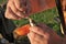 Fisherman removes the hook with bait