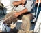 Fisherman repairing a fishnet in his boat