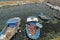 Fisherman repairs his net on boat