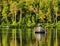 A fisherman returning to the lake