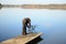 Fisherman with rod pod, feeders, electronic bite alarms on pier