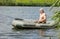 Fisherman rowing a rubber dinghy