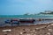 Fisherman`s boats on a beach in San Andres Island with buildings in the background. Colombia.