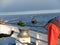 A fisherman`s hand securing a rope and boats