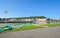 A fisherman`s net lies on a small stretch of park across the port from the fishing village of Honfleur France on a sunny day