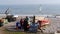 Fisherman selling his catch on a beach in England