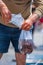 Fisherman sells live octopuses in a package on a small fish mark