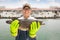 fisherman showing fish before fishing ship