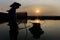 Fisherman silhouette with fishing net