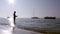 Fisherman silhouette at Ria Formosa wetlands, Algarve, Portugal.