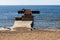 Fisherman sitting on the end of a pier