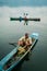 Fisherman in a small boat with his traps on the biggest lake in