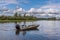 Fisherman in small motor boat on Chena River, Fairbanks, Alaska, USA