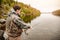 Fisherman spool of rope using rod fly fishing in river