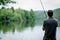 Fisherman standing on the banks of Vltava, fishing concept