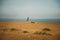 Fisherman standing and throw a fishing rod while fishing at the sea in the summer season. Fishing under the clean blue sky and