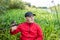 Fisherman in the thickets of reeds on the river bank. Spinning player portrait