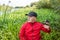 Fisherman in the thickets of reeds on the river bank. Spinning player portrait