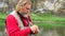 A fisherman ties a fly on a hook. Fly fishing. Hands of an elderly man close-up. Sport and hobbies.